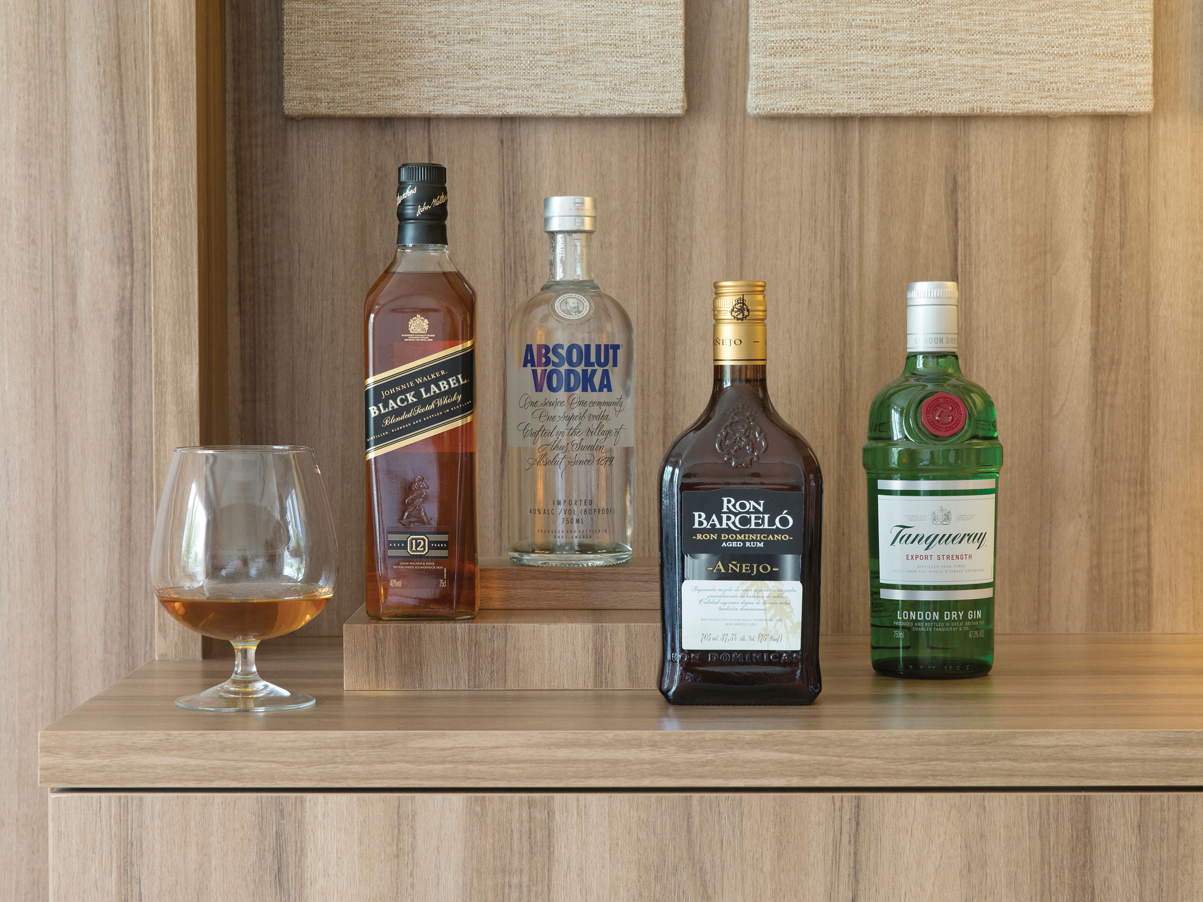 Indulge in the upgraded liquor selection in the Excellence Club Beachfront House Suite with Plunge Pool in Excellence Oyster Bay
