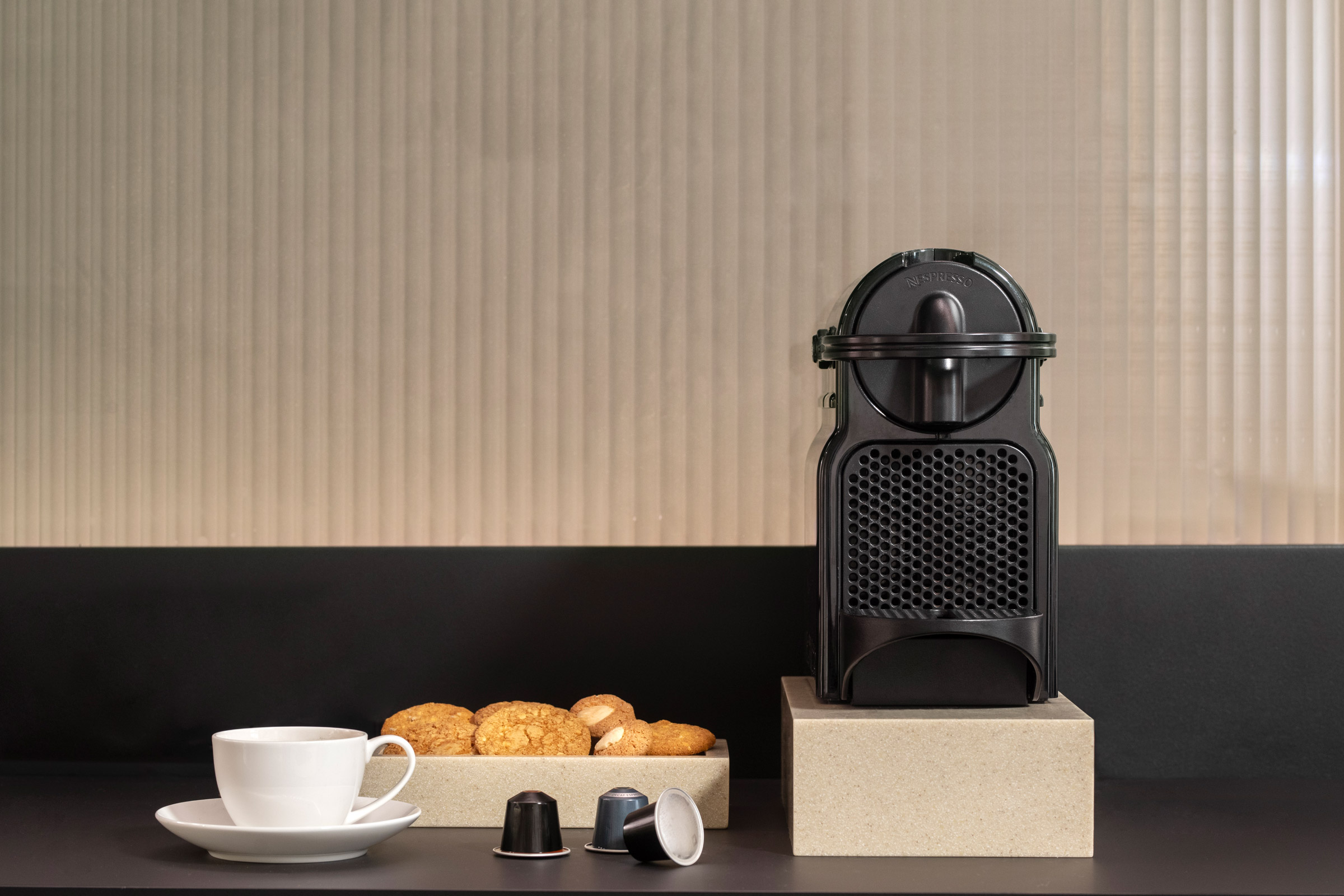 Coffee machine and cup on a desk in a Cancun suite